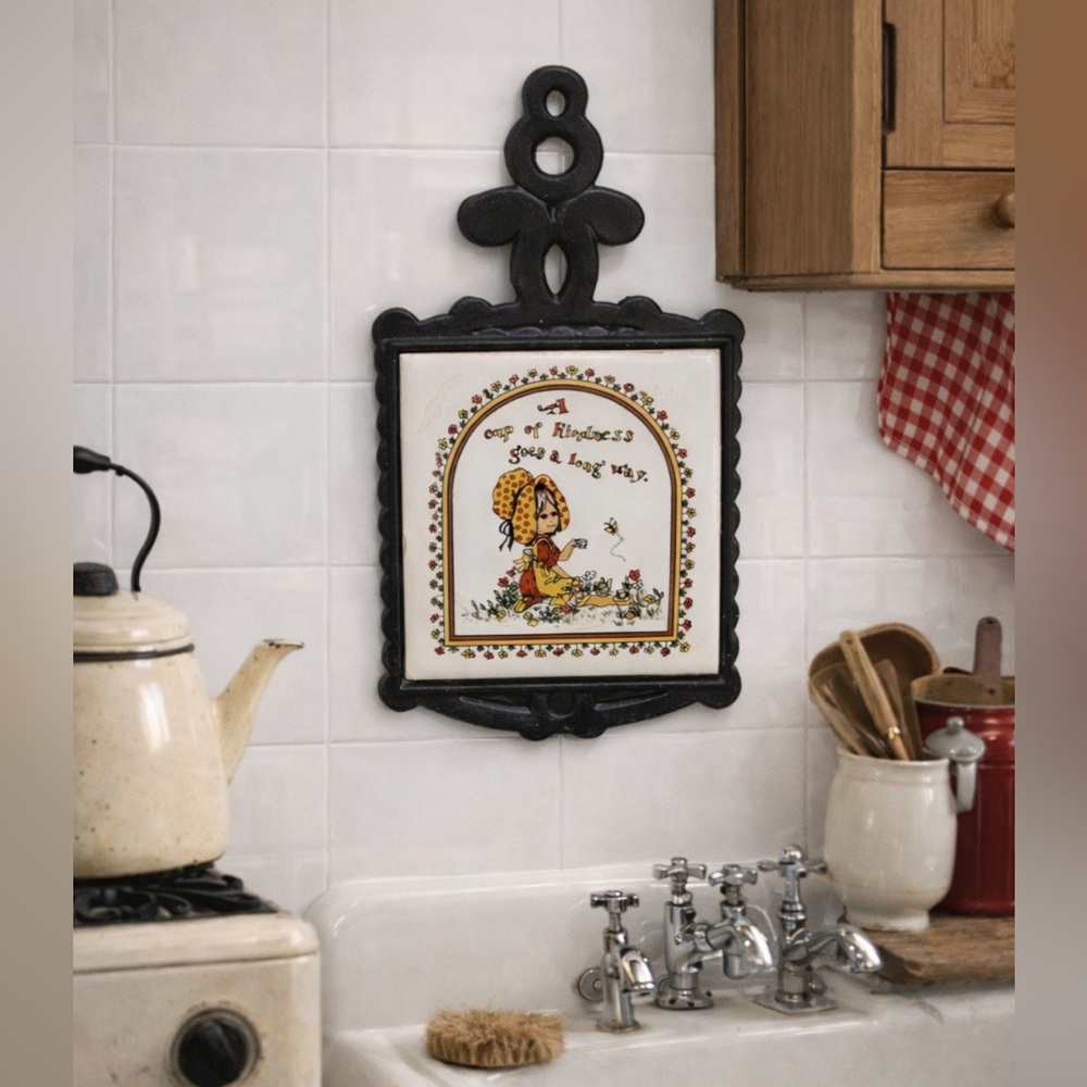 vintage cast-iron trivet with a ceramic tile insert, made by Seven Star